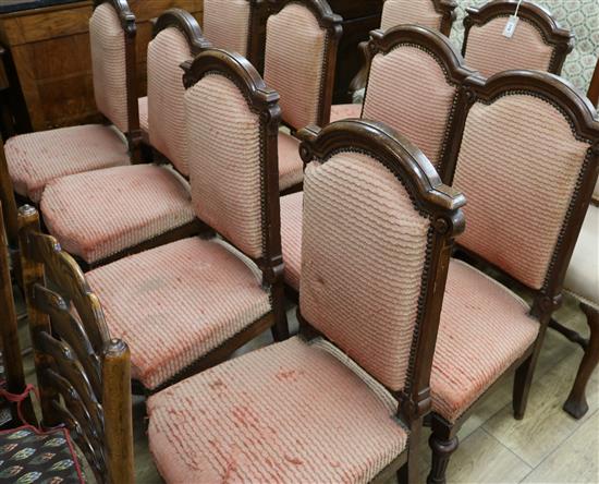 A set of ten Victorian oak red upholstered dining chairs